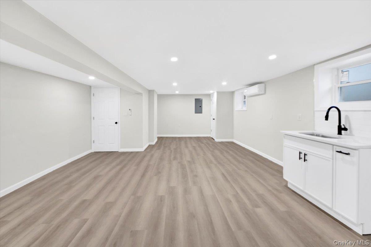 1625 Overing Street Bronx, NY 10461 - Photo 17 of 25 a view of a room with wooden floor and sink