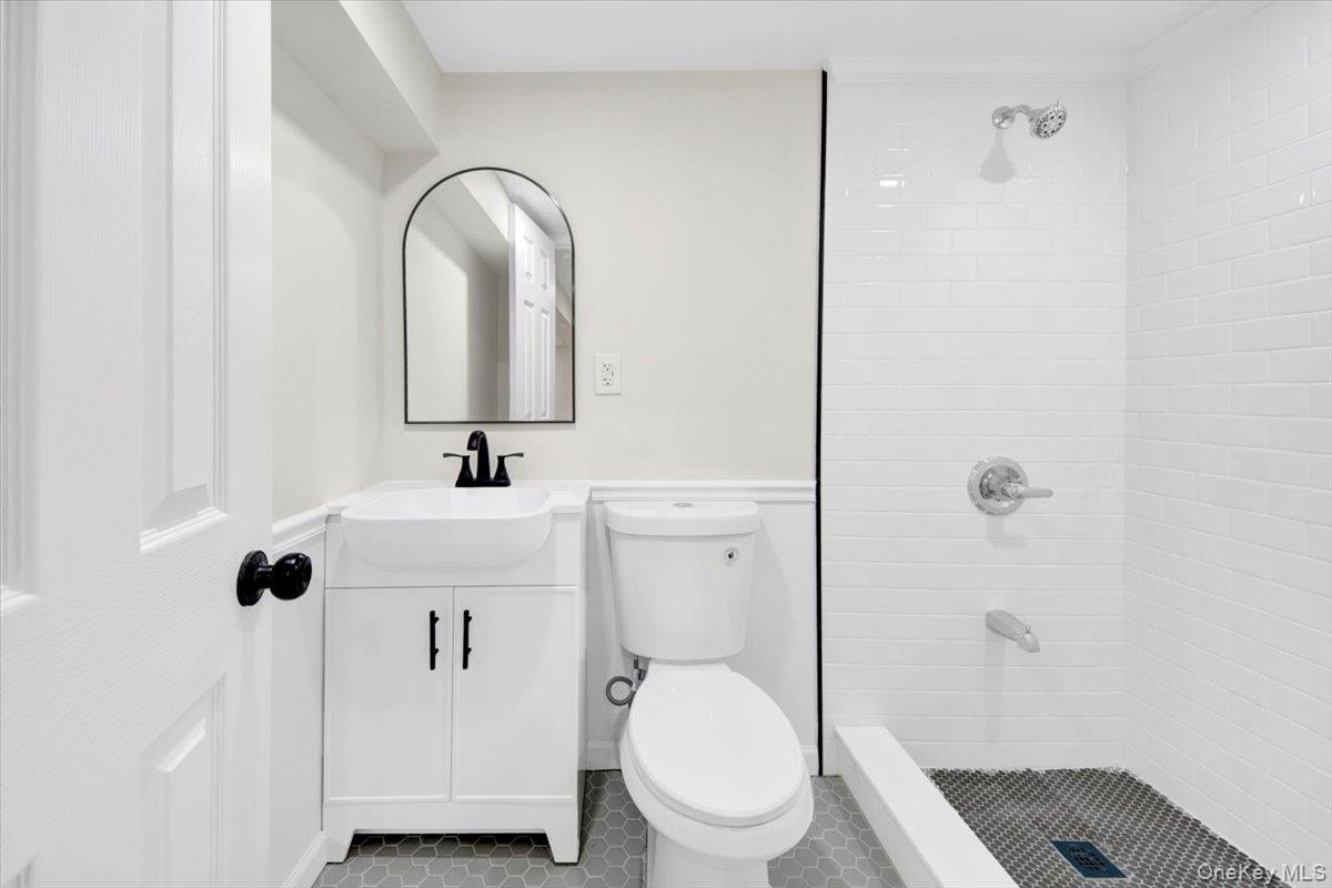 1625 Overing Street Bronx, NY 10461 - Photo 20 of 25 a bathroom with a toilet sink and shower