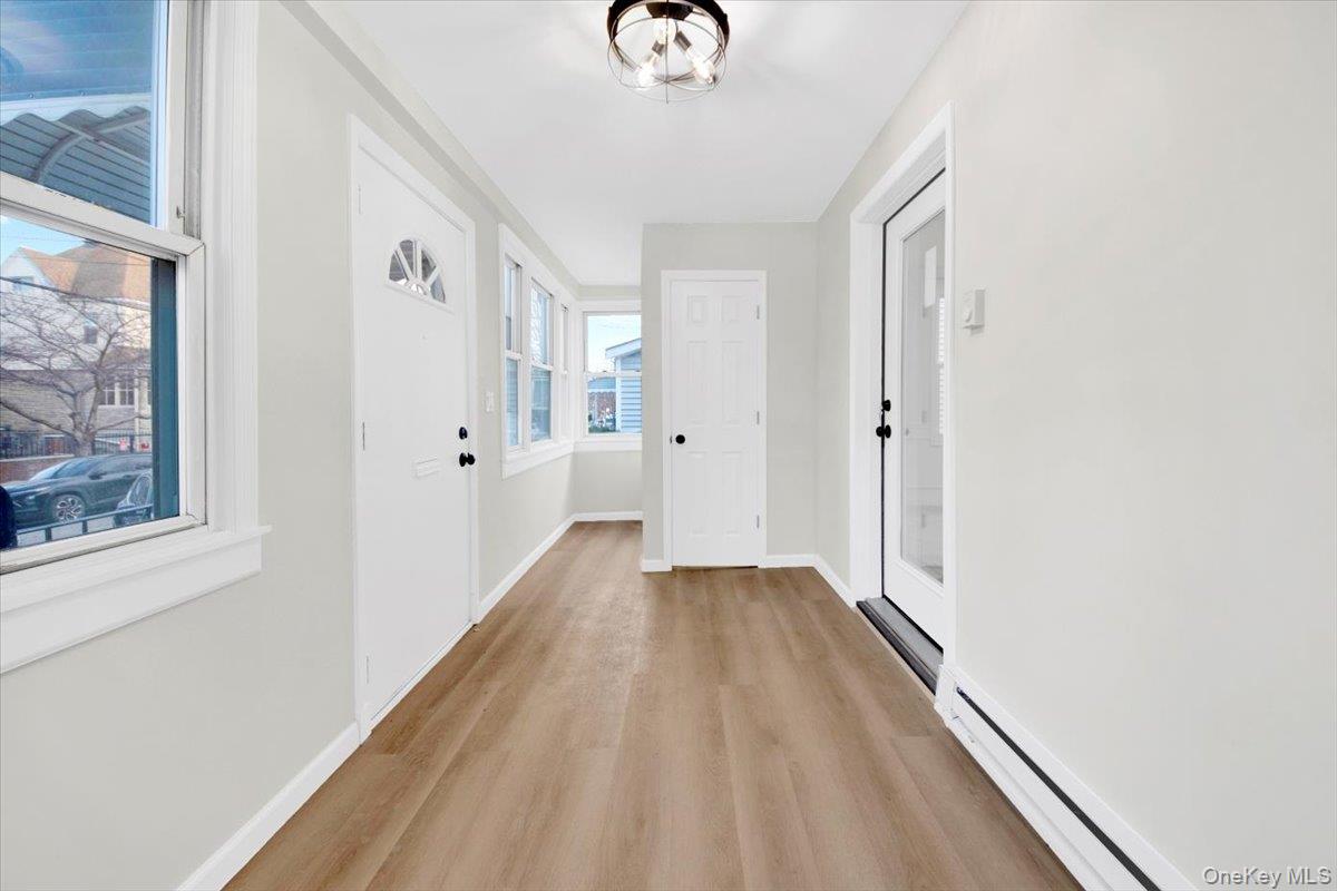 1625 Overing Street Bronx, NY 10461 - Photo 3 of 25 a view of a hallway with wooden floor
