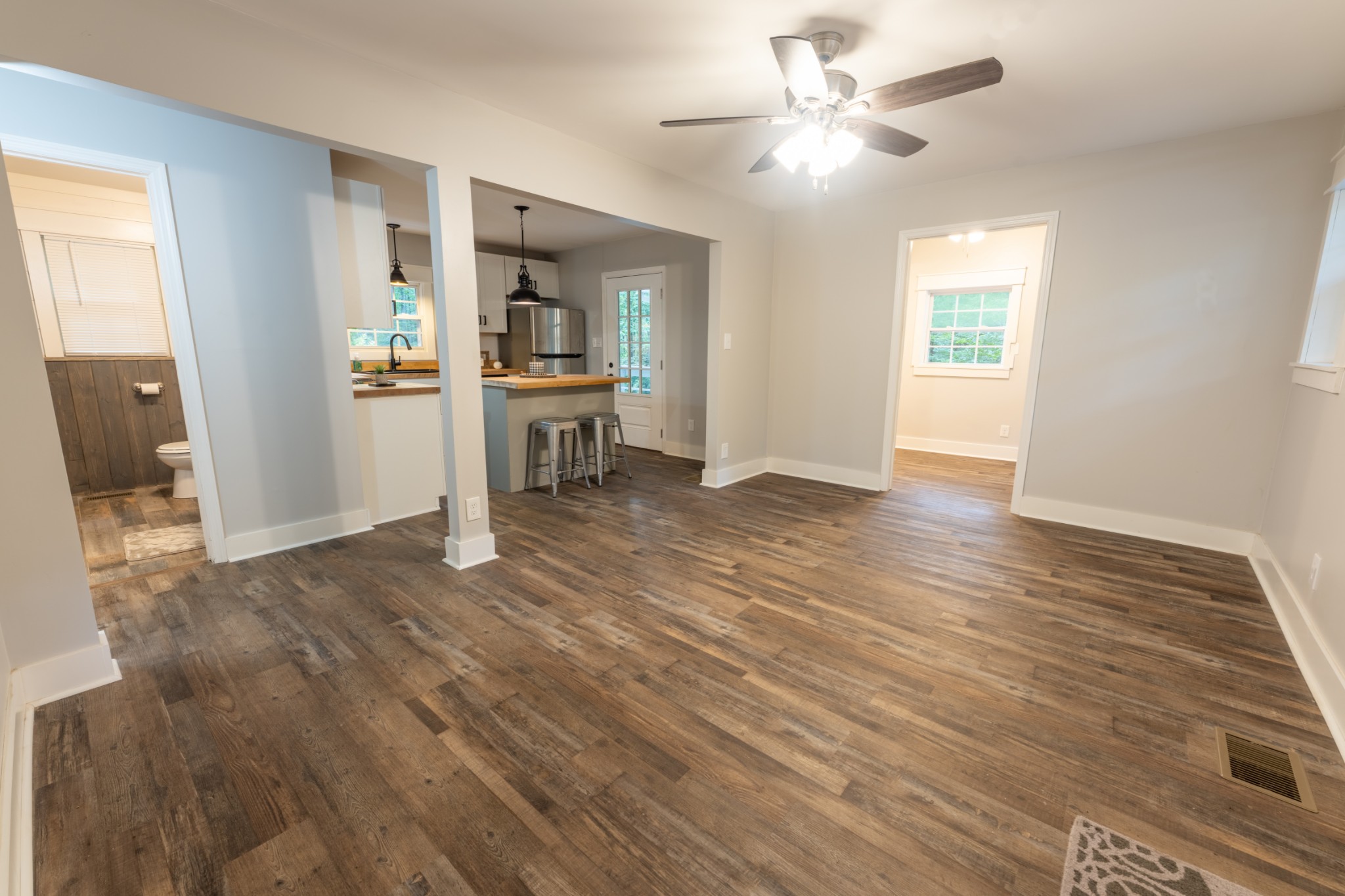 121 Smith Road Winchester, TN 37398 - Photo 19 of 31 a view of kitchen and empty room with wooden floor