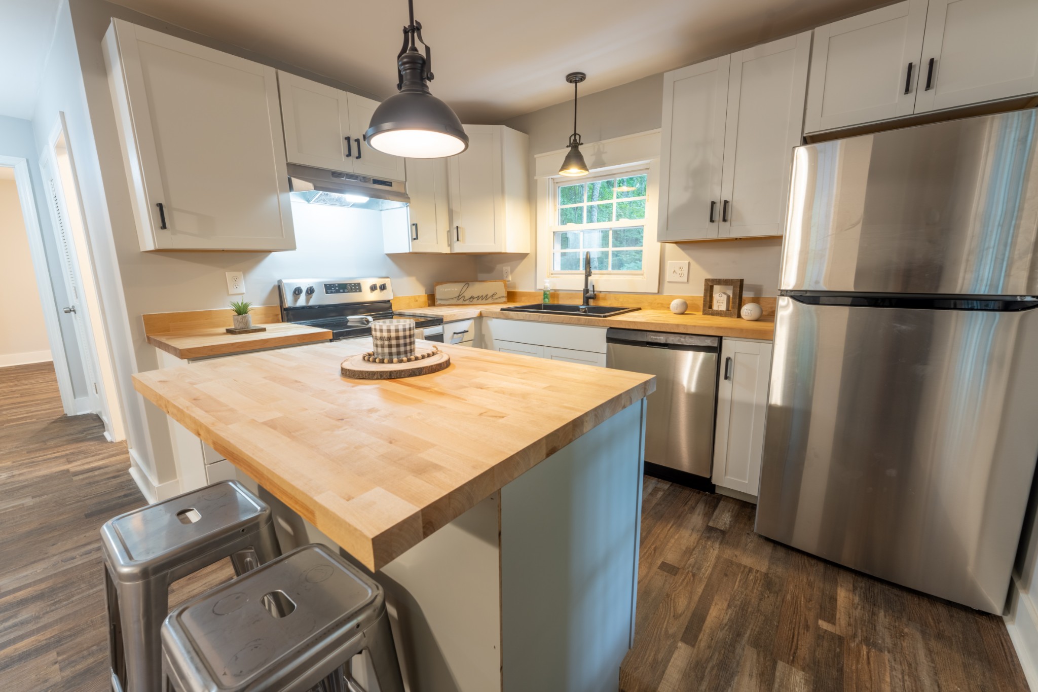 121 Smith Road Winchester, TN 37398 - Photo 21 of 31 a kitchen with a refrigerator a stove a sink and a stove