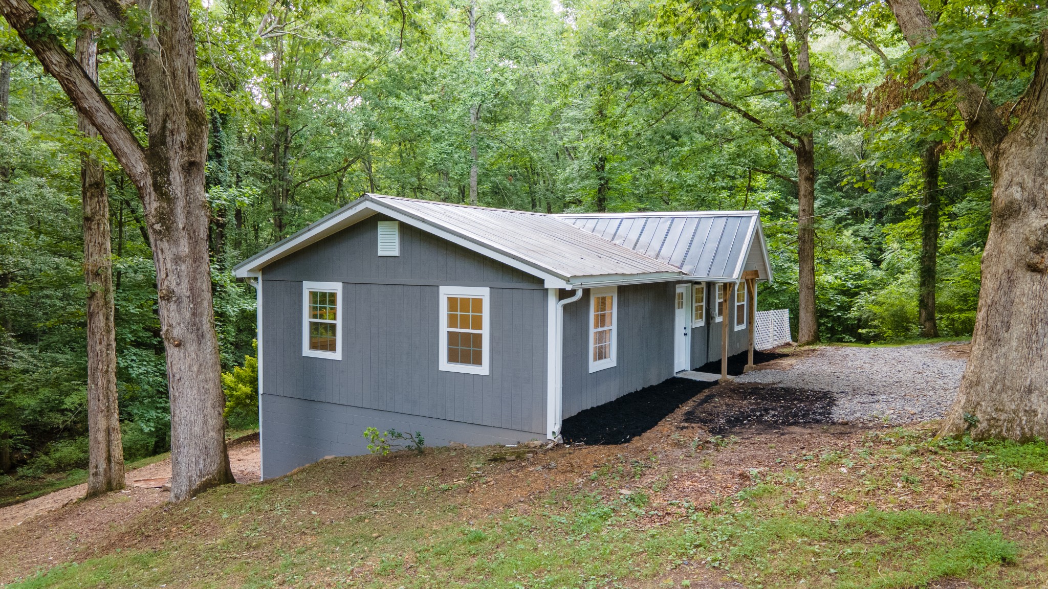 121 Smith Road Winchester, TN 37398 - Photo 8 of 31 a view of a house with a yard and large trees