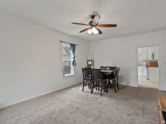 510 Canyon Road Ogden, UT 84404 - Photo 7 of 30 Dining room featuring light colored carpet, a ceiling fan, and a textured ceiling