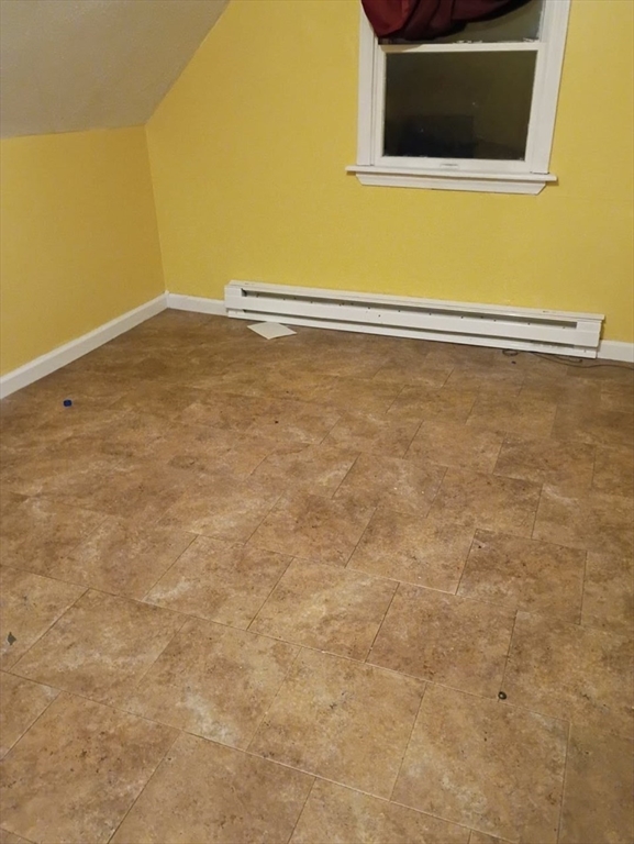 51 View Street Holyoke, MA 01040 - Photo 6 of 16 a view of empty room with wooden floor and fan