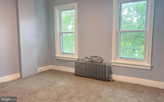 an empty room with windows