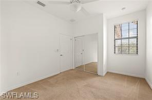 7415 Bristol Circle Naples, FL 34120 - Photo 4 of 10 an empty room with windows