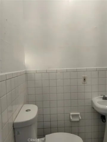 a view of a house with a yard next to a road