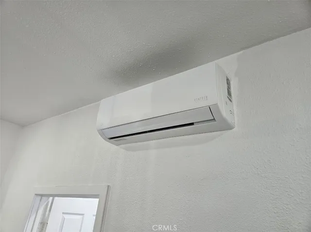 a kitchen with granite countertop a sink cabinets and wooden floor