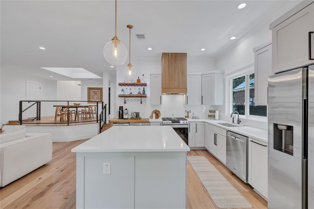 3600 Rip Ford Drive Austin, TX 78732 - Photo 13 of 32 a large kitchen with stainless steel appliances a stove a sink a oven and a refrigerator