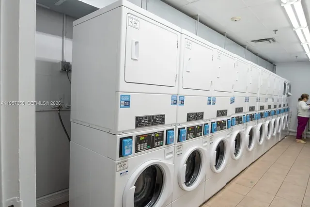 a kitchen with stainless steel appliances granite countertop a refrigerator a sink and dishwasher