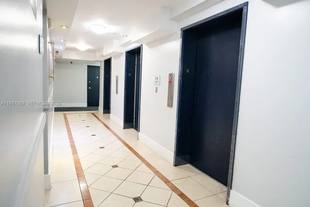 a table with wine bottles and glasses on it