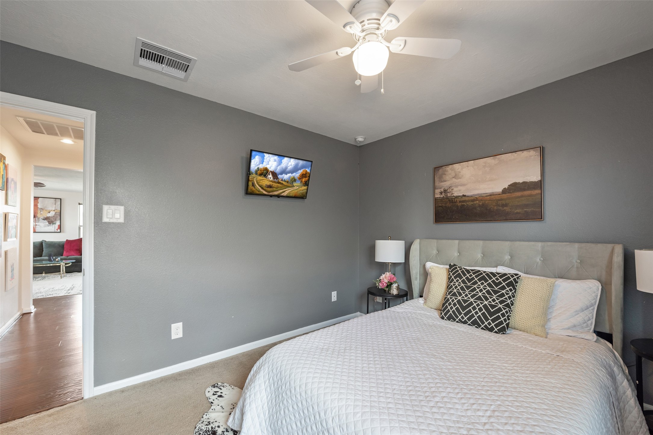 3554 Bennett Trails Drive Spring, TX 77386 - Photo 36 of 44 a bedroom with a large bed and a chandelier