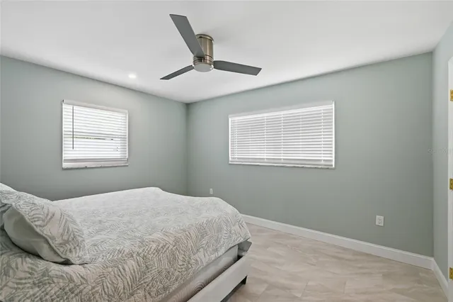 a view of a patio with a table and chairs next to a yard