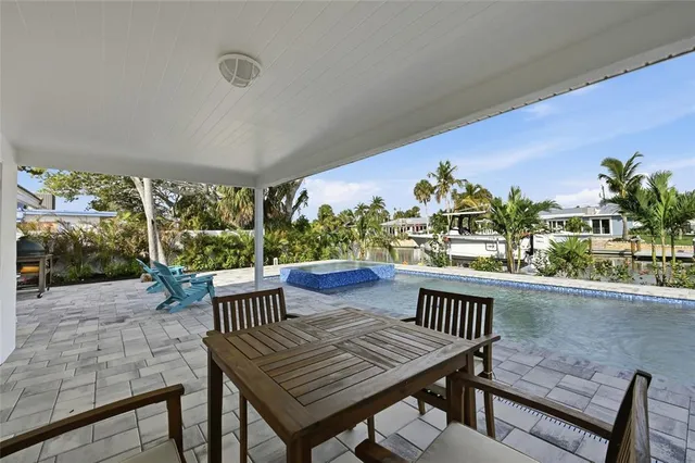 a view of a patio with couches and potted plants
