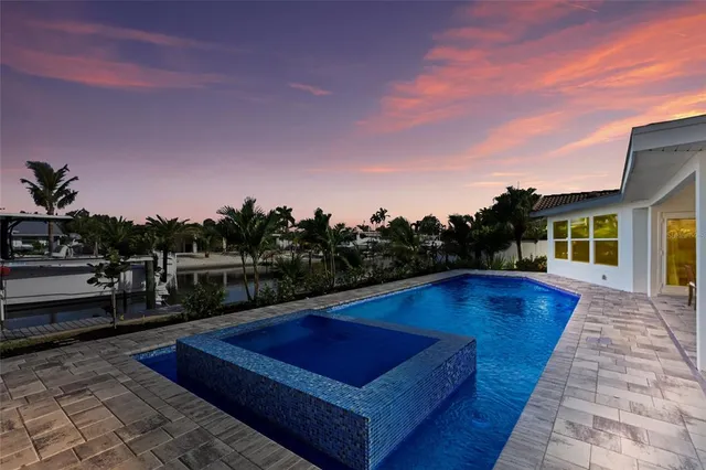 a view of a garden with a bench in front of it