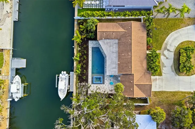 an aerial view of a house with outdoor space