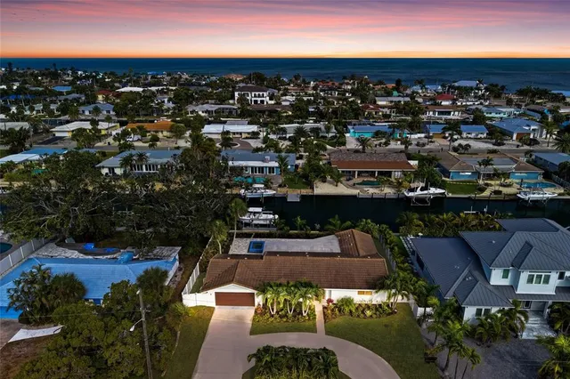an aerial view of a houses with outdoor space