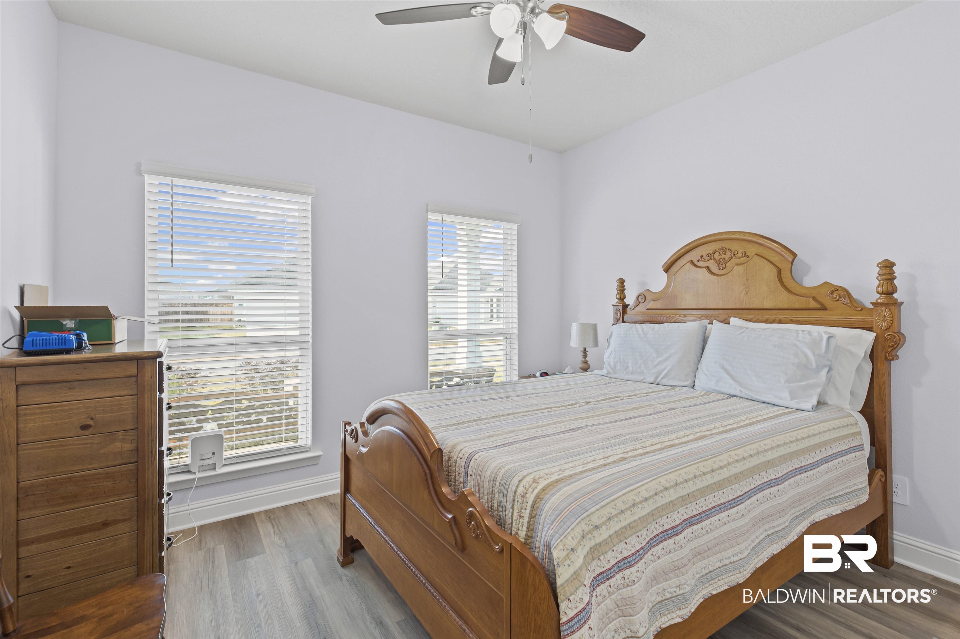 10564 Heirloom Road South Mobile, AL 36608 - Photo 16 of 24 Bedroom featuring wood finished floors and ceiling fan