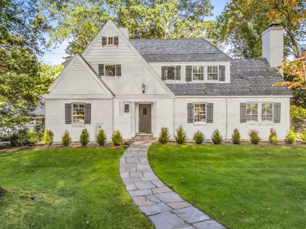 91 Old Colony Road Wellesley, MA 02481 - Photo 1 of 35 a front view of a house with a yard
