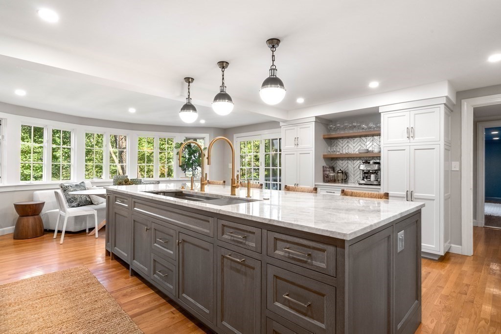 91 Old Colony Road Wellesley, MA 02481 - Photo 16 of 35 a kitchen with stainless steel appliances granite countertop a sink and a large window