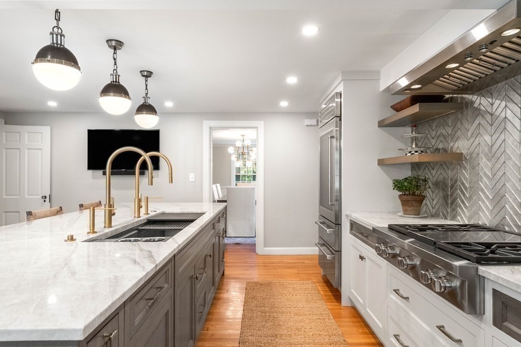 91 Old Colony Road Wellesley, MA 02481 - Photo 18 of 35 a kitchen with granite countertop a sink stainless steel appliances and cabinets