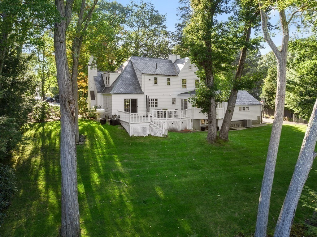 91 Old Colony Road Wellesley, MA 02481 - Photo 2 of 35 a front view of house with yard and green space