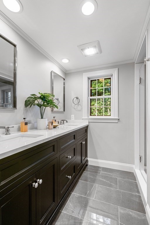 91 Old Colony Road Wellesley, MA 02481 - Photo 25 of 35 a spacious bathroom with a granite countertop sink a mirror and a window