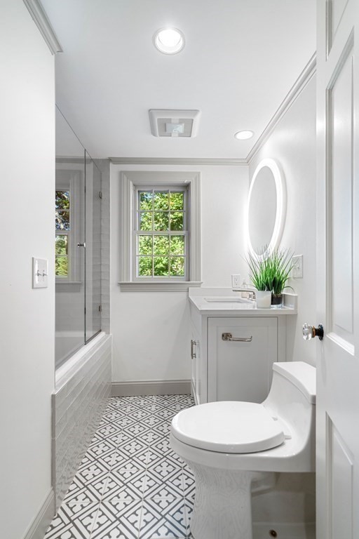 91 Old Colony Road Wellesley, MA 02481 - Photo 27 of 35 a bathroom with a toilet sink and mirror