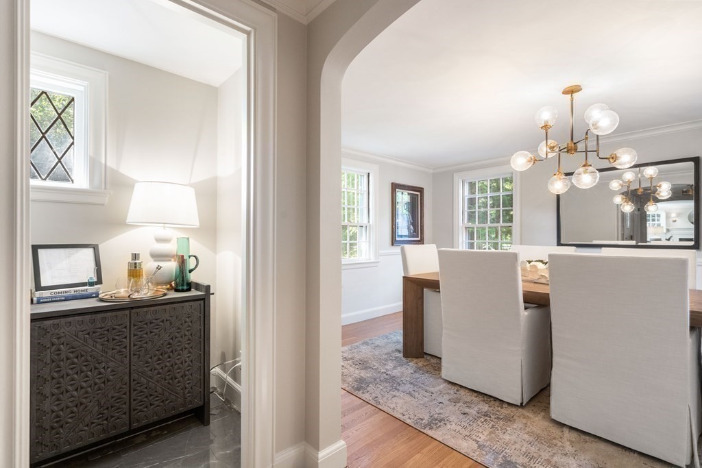 91 Old Colony Road Wellesley, MA 02481 - Photo 10 of 35 a dining room with furniture and chandelier