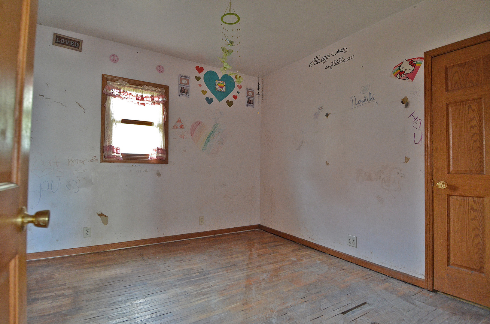 266 Clark Street Marseilles, IL 61341 - Photo 4 of 12 a view of an empty room with a window