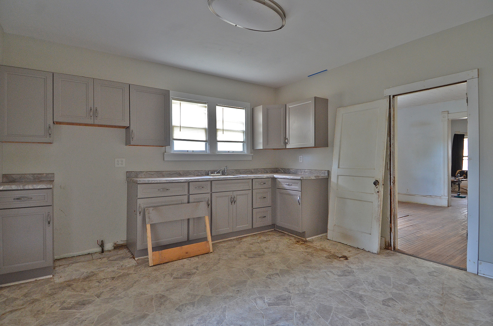 266 Clark Street Marseilles, IL 61341 - Photo 6 of 12 a kitchen with white cabinets and white appliances