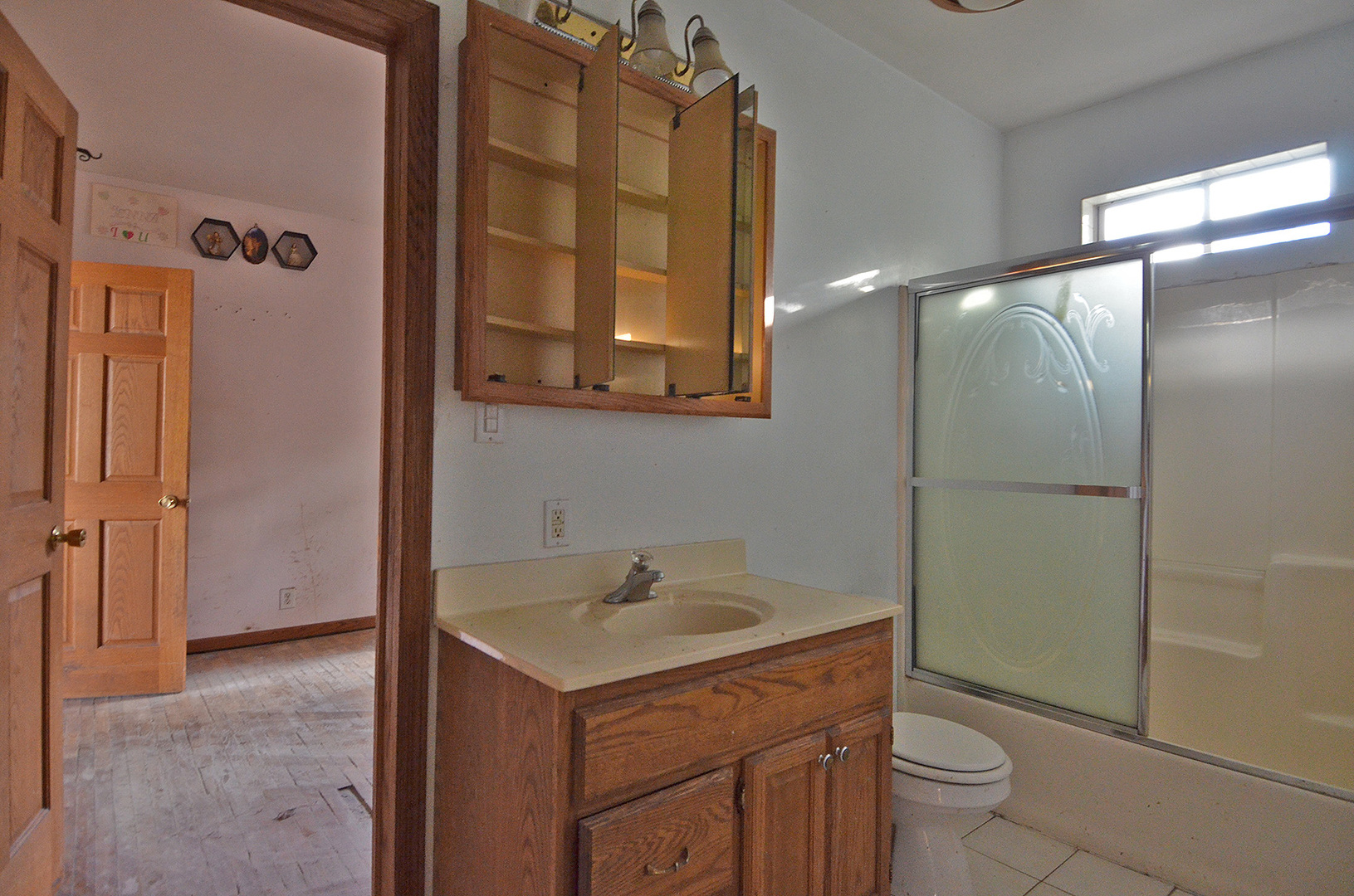 266 Clark Street Marseilles, IL 61341 - Photo 7 of 12 a bathroom with a sink toilet and shower