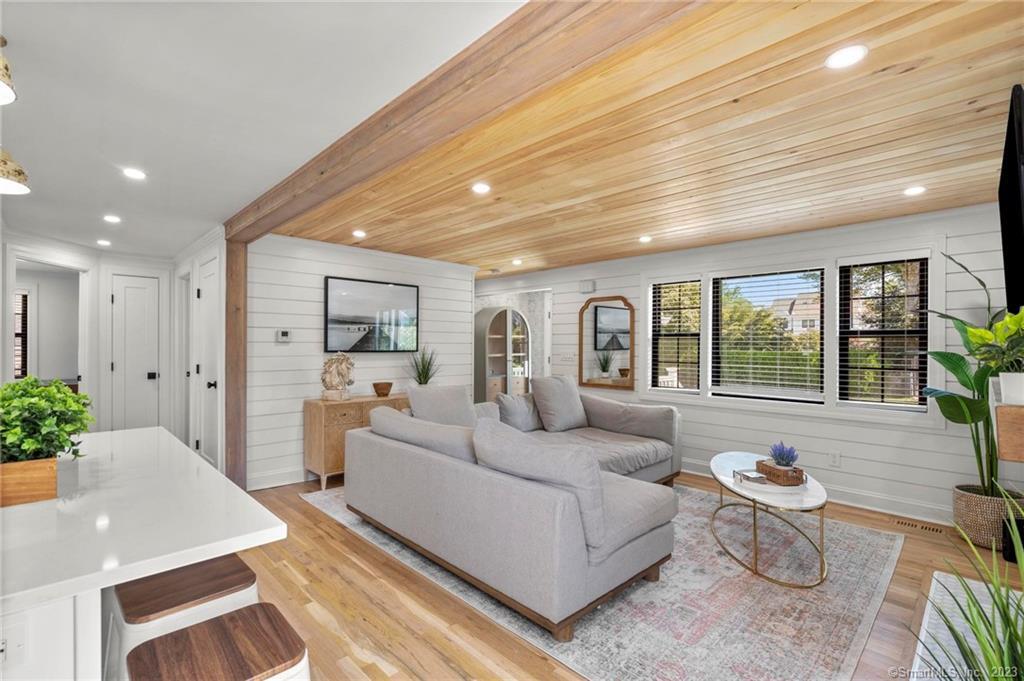 22 Oldfield Drive Fairfield, CT 06824 - Photo 11 of 30 a living room with furniture and a large window