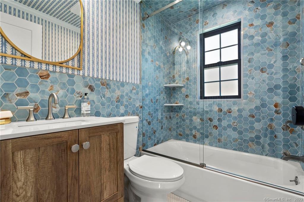 22 Oldfield Drive Fairfield, CT 06824 - Photo 16 of 30 a bathroom with a sink a toilet and bathtub