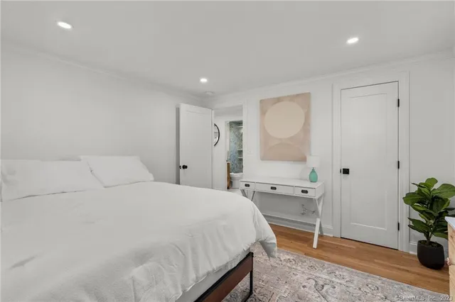 a bedroom with a bed and a table