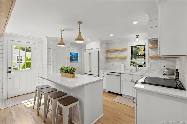 a kitchen with a sink cabinets and window