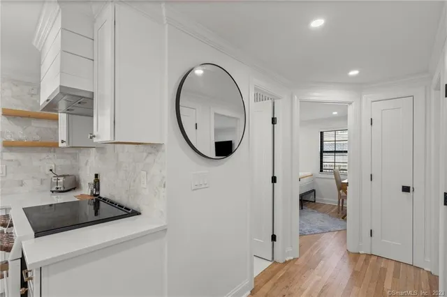 a kitchen with a refrigerator and cabinets
