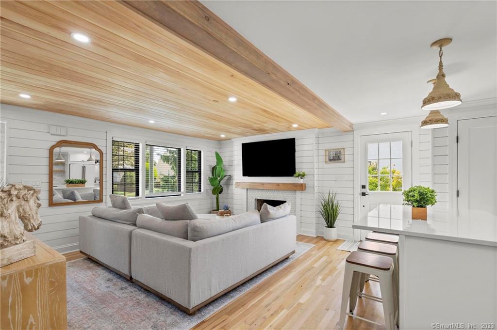 22 Oldfield Drive Fairfield, CT 06824 - Photo 10 of 30 a living room with furniture and a flat screen tv