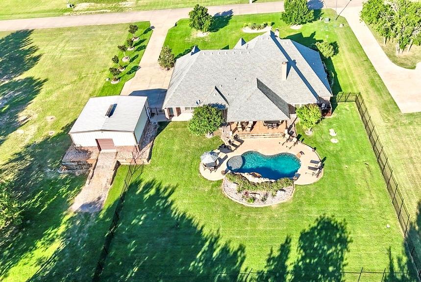 1387 Shadow Lakes Drive Wills Point, TX 75169 - Photo 1 of 33 a view of swimming pool with a garden and patio