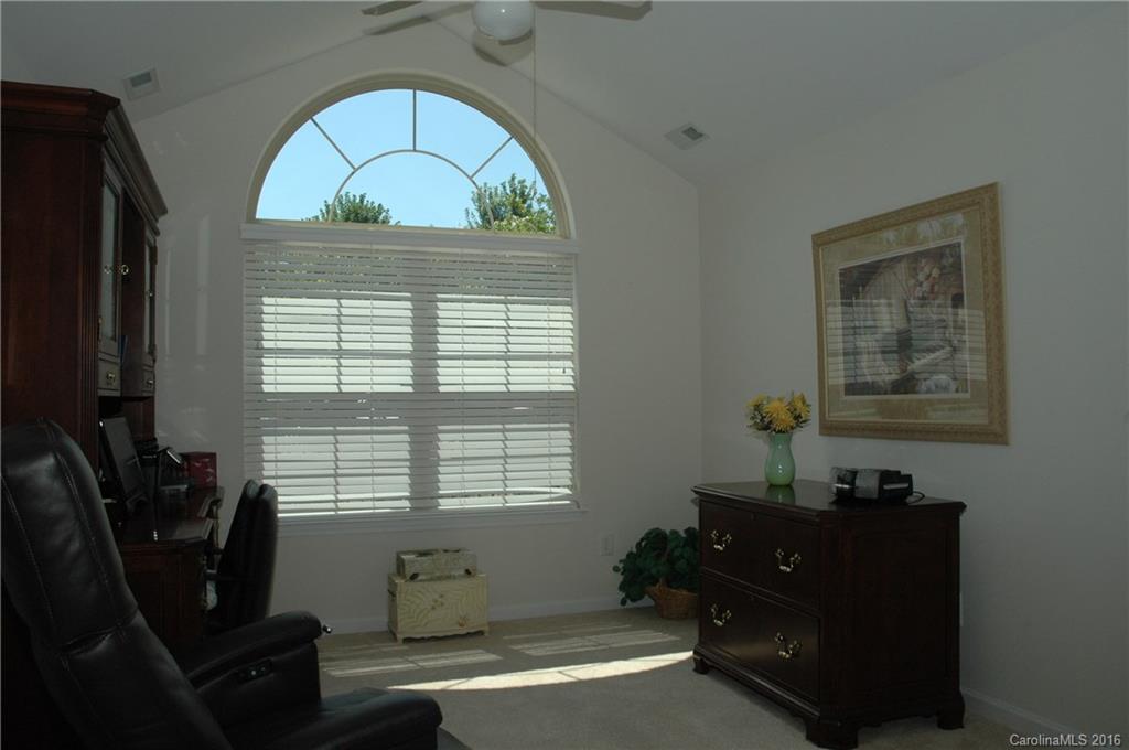 730 Ledgestone Court, Unit 730 Tega Cay, SC 29708 - Photo 14 of 19 a living room with furniture and a window
