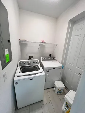 a utility room with dryer and washer
