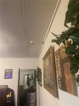 a bedroom with a bed and a lamp