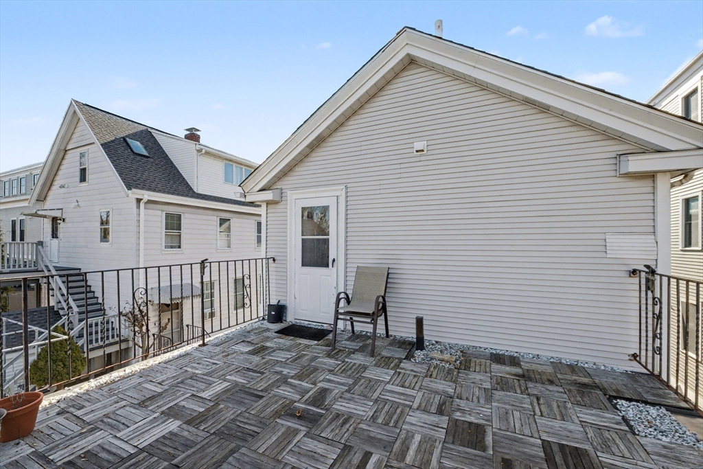 46 Waverly Street, Unit 2 Boston, MA 02135 - Photo 13 of 18 a view of a house with wooden fence