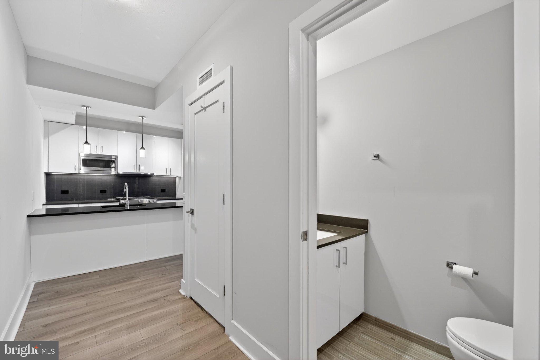 88 V Street Southwest, Unit 213 Washington, DC 20024 - Photo 5 of 26 Modern kitchen with sleek finishes.