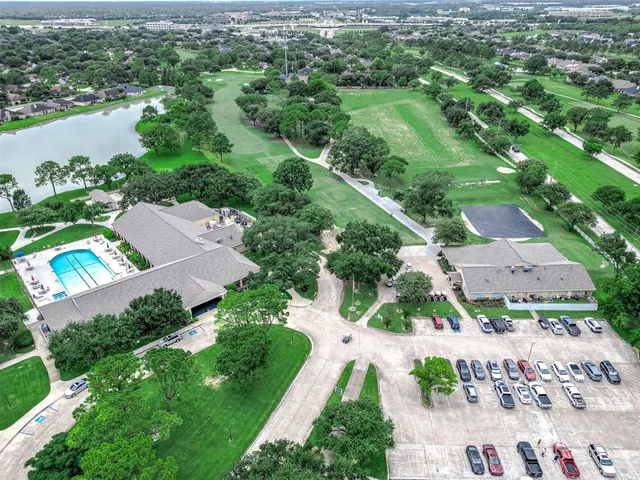 an aerial view of a house with a lake view