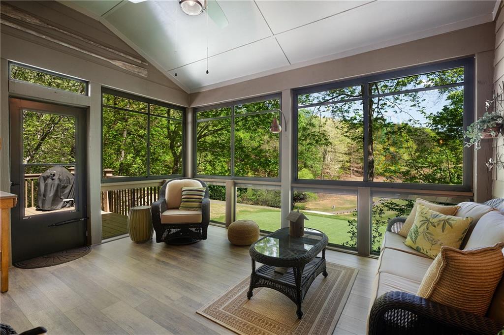 208 Muirfield Way Jasper, GA 30143 - Photo 22 of 59 a living room with furniture and floor to ceiling windows