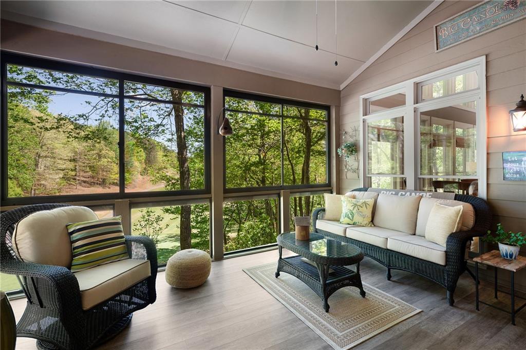 208 Muirfield Way Jasper, GA 30143 - Photo 23 of 59 a living room with furniture and floor to ceiling windows