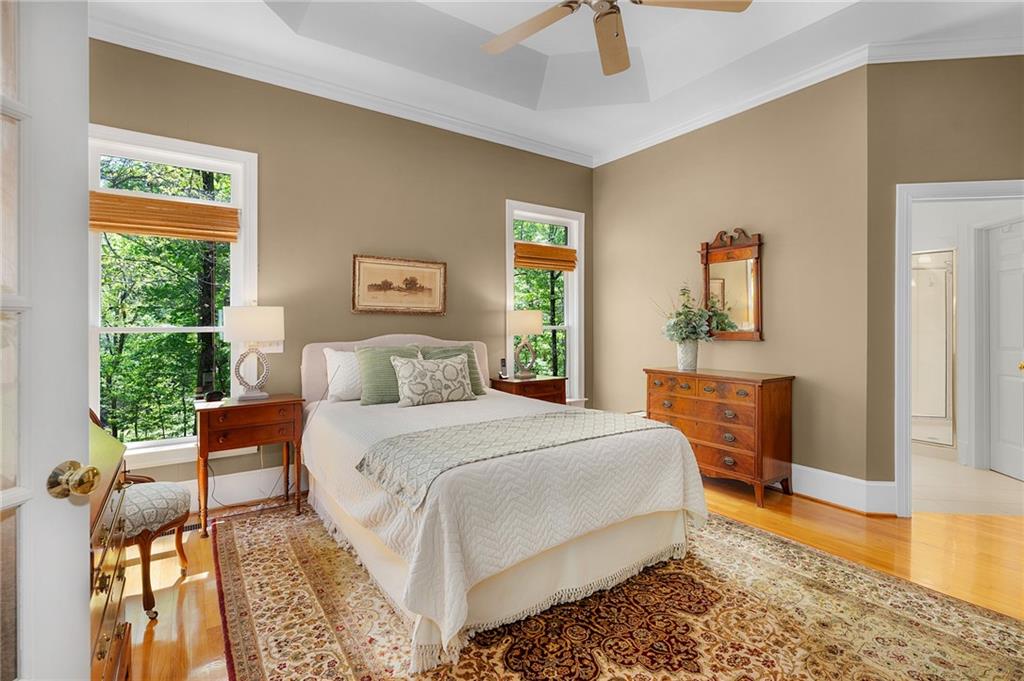 208 Muirfield Way Jasper, GA 30143 - Photo 25 of 59 a bedroom with a bed and wooden floor