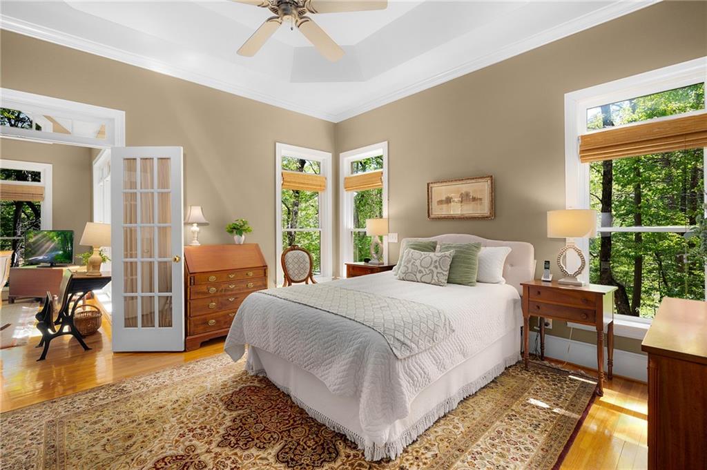 208 Muirfield Way Jasper, GA 30143 - Photo 26 of 59 a bedroom with a bed a table and chair