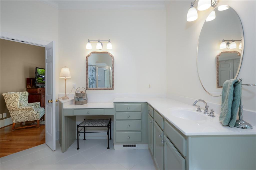 208 Muirfield Way Jasper, GA 30143 - Photo 27 of 59 a bathroom with a sink vanity and a mirror